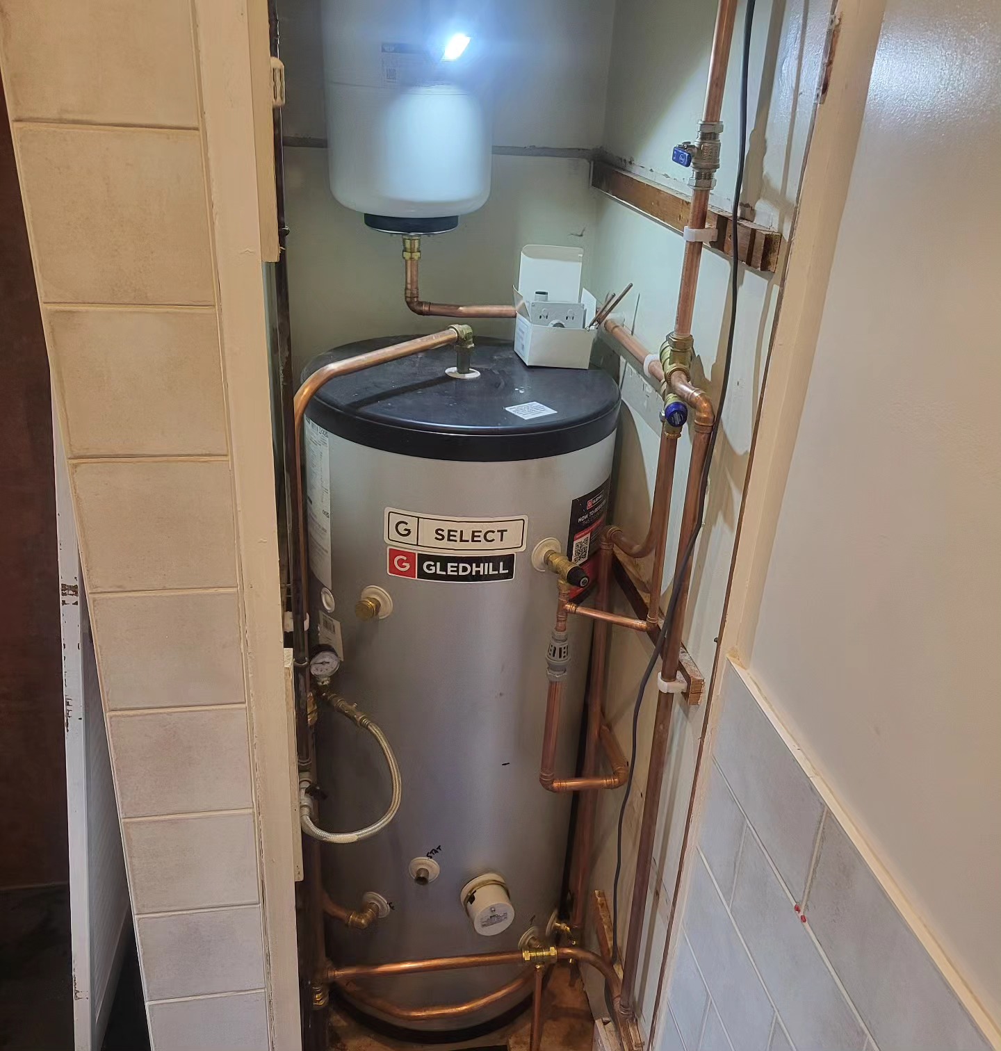 Gravity cylinder swap for mains-fed unvented